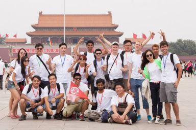 Shi Shuo (green scarf) with students at Forbidden City_Summer Camp 2014.jpg