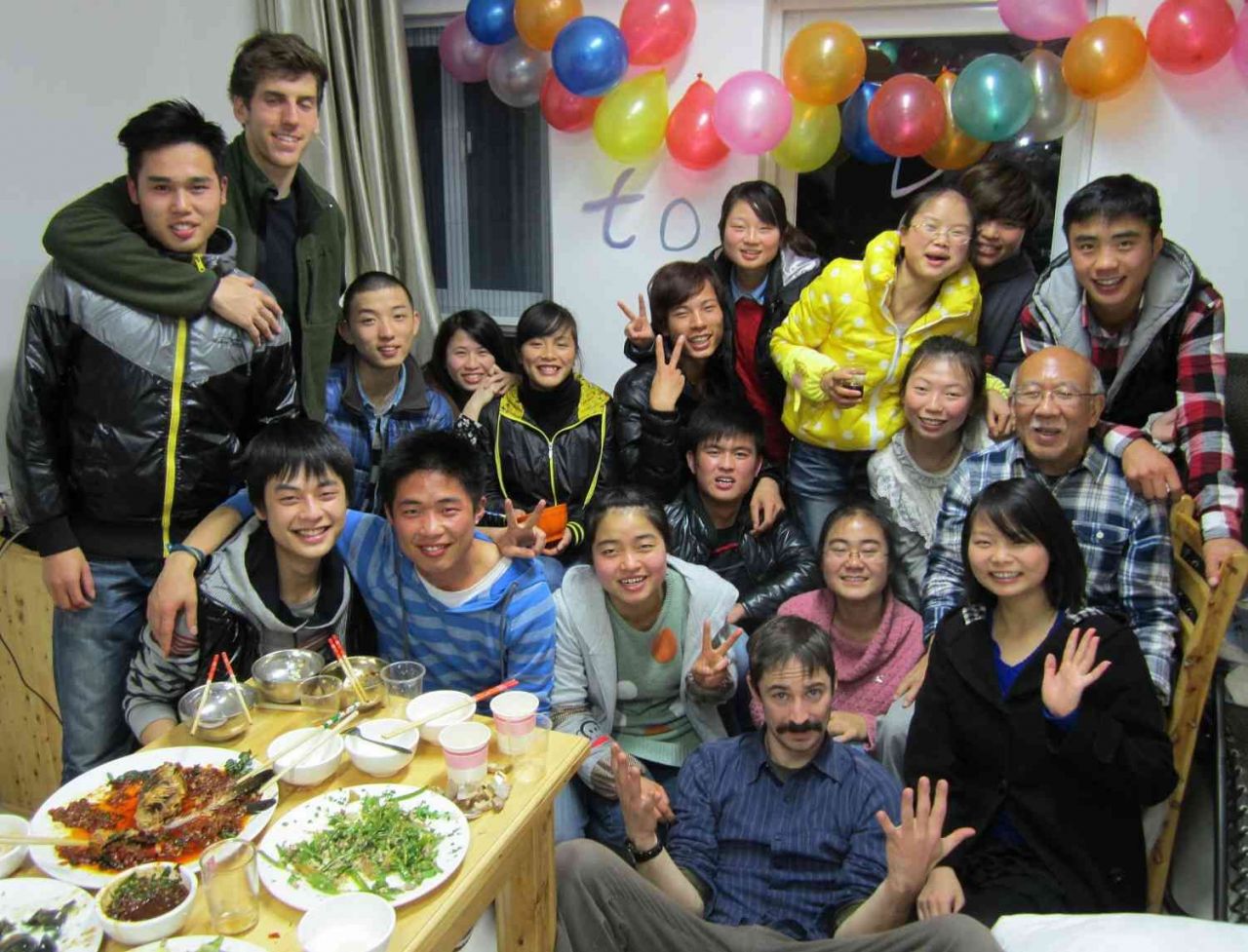 Birthday Party - Chinese students cook for and celebrate their volunteer teacher's birthday. 